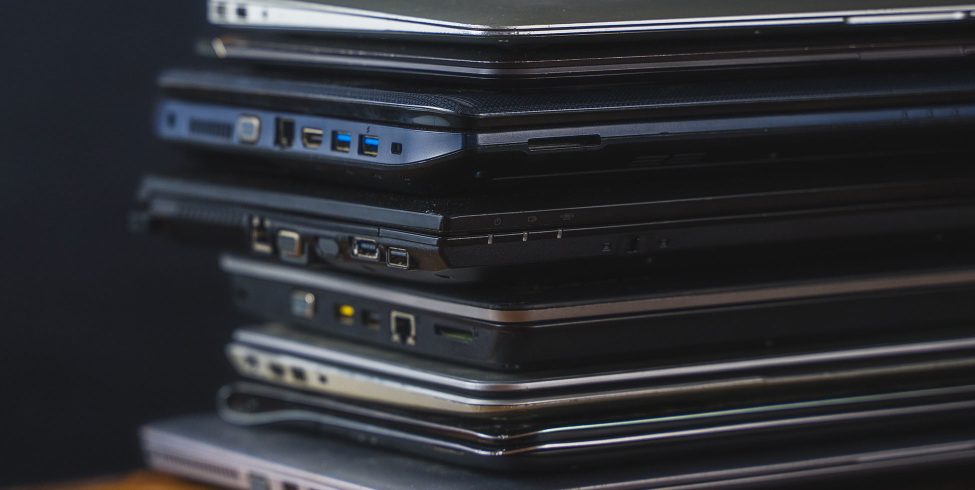 Stack of old, outdated laptops